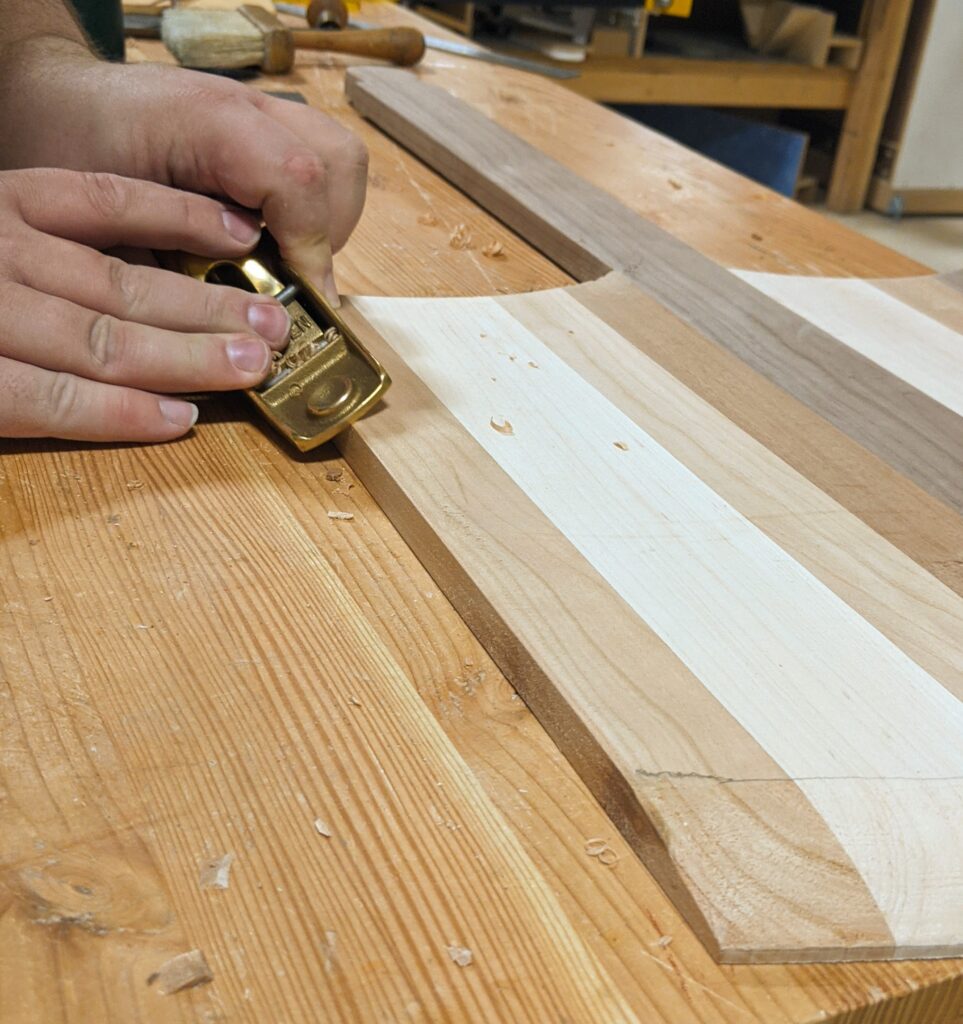 Using a block planer to soften the edges.